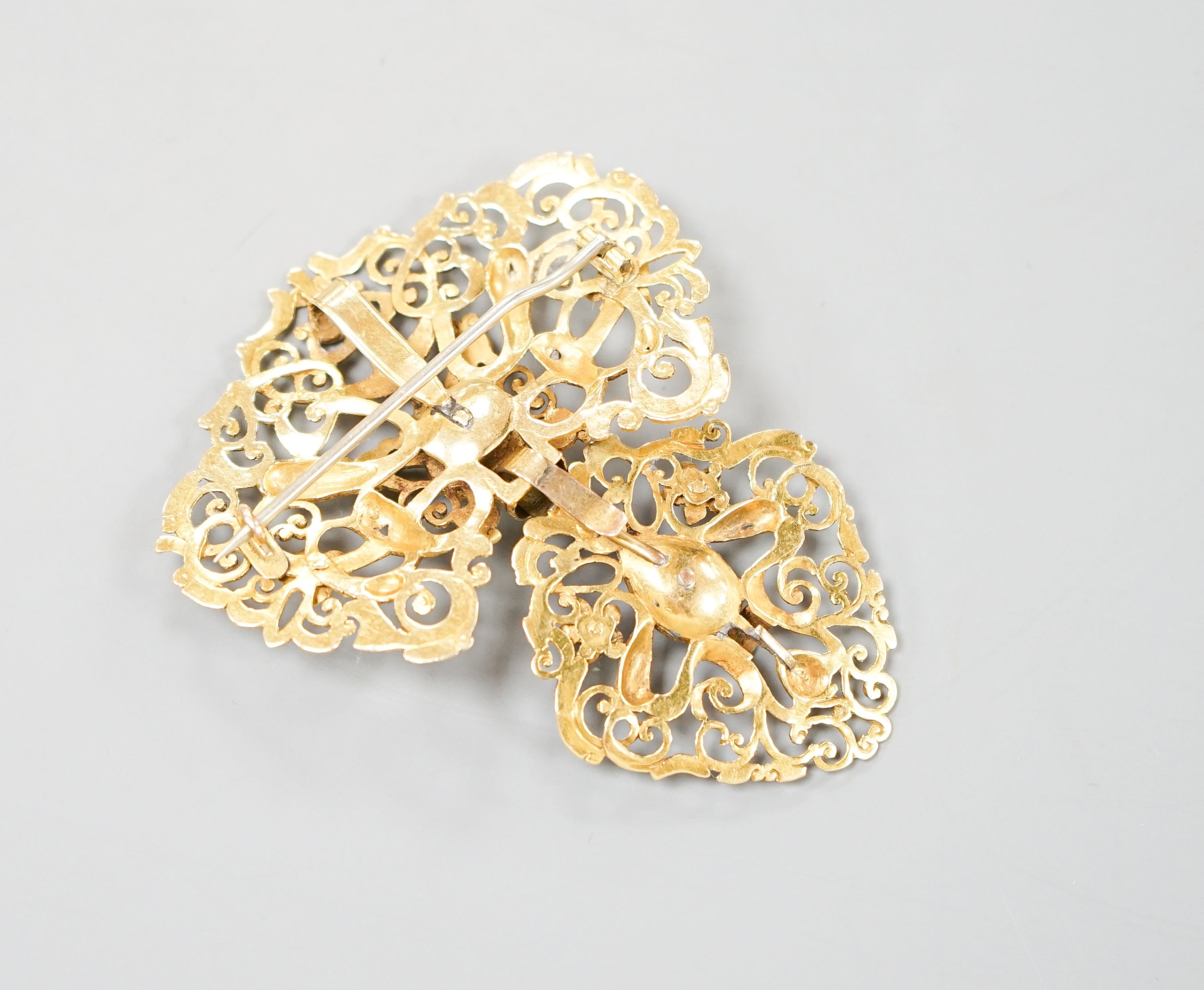 An Indian pierced yellow metal and two stone rose cut diamond set drop pendant brooch, 64mm, gross weight 15.8 grams.